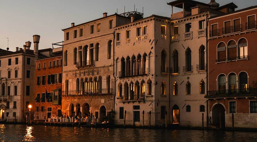 Historic Venetian building beside a canal at dusk