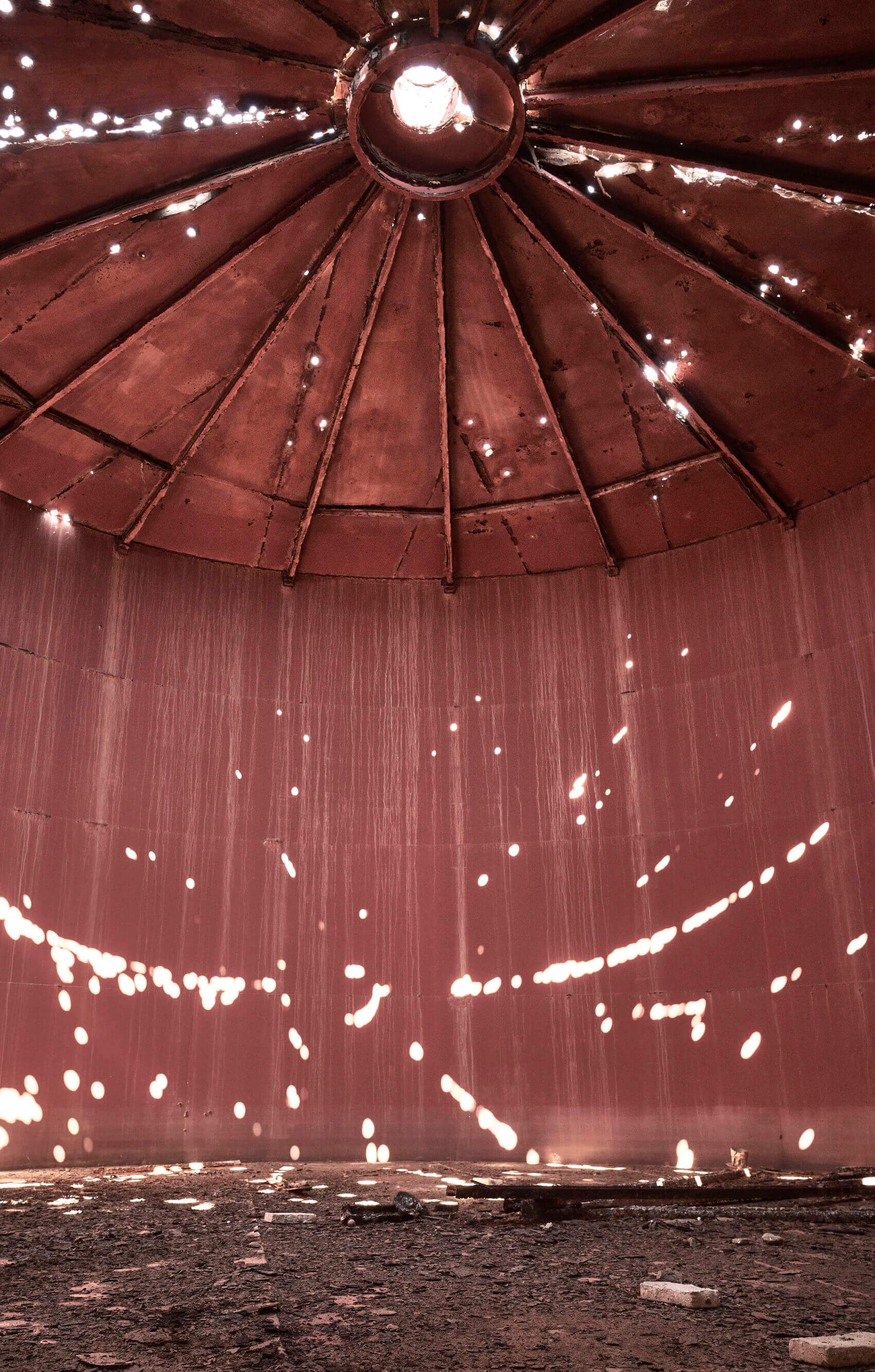 A large metal dome with a hole in the center.