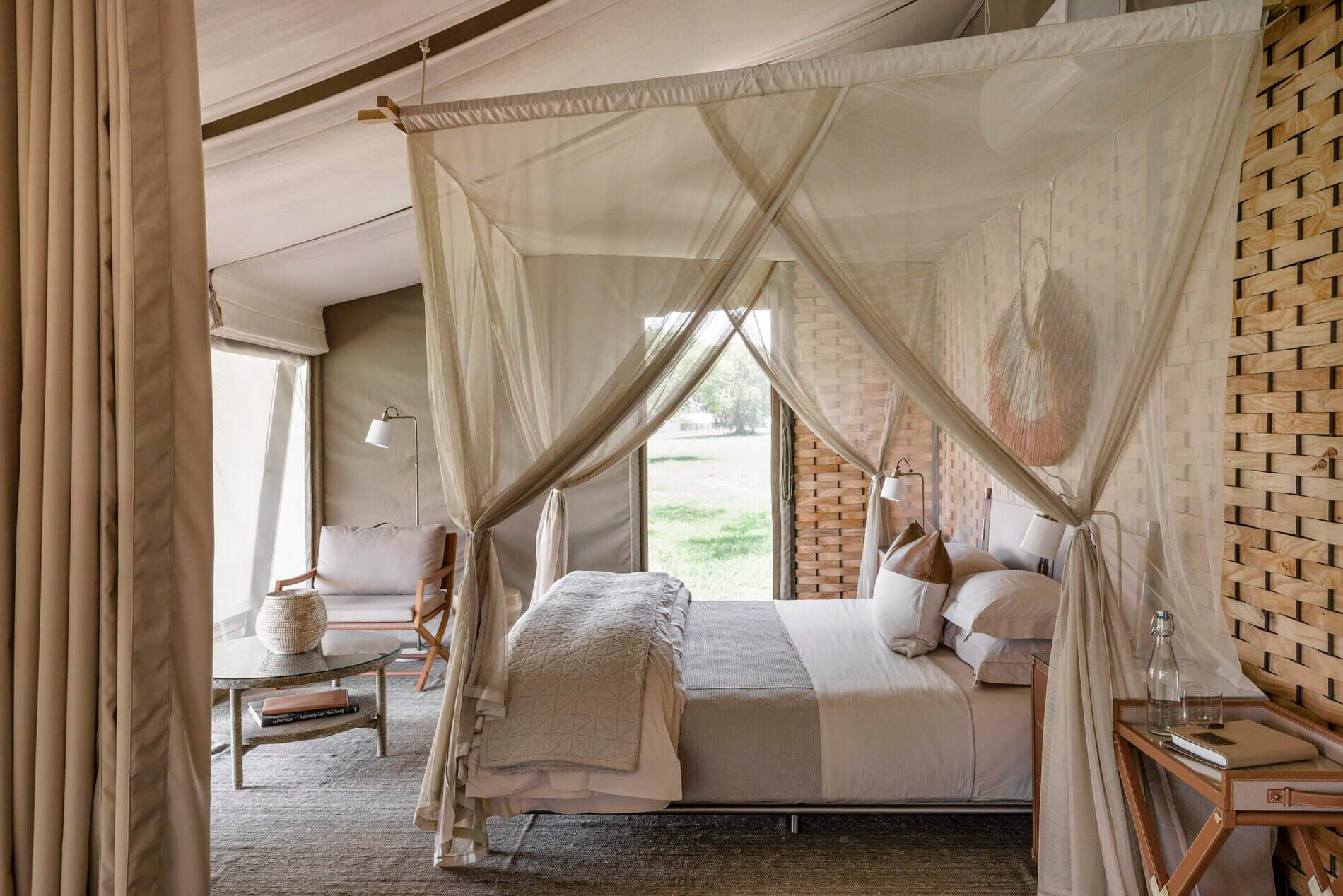 A bedroom with a white bed and a canopy.