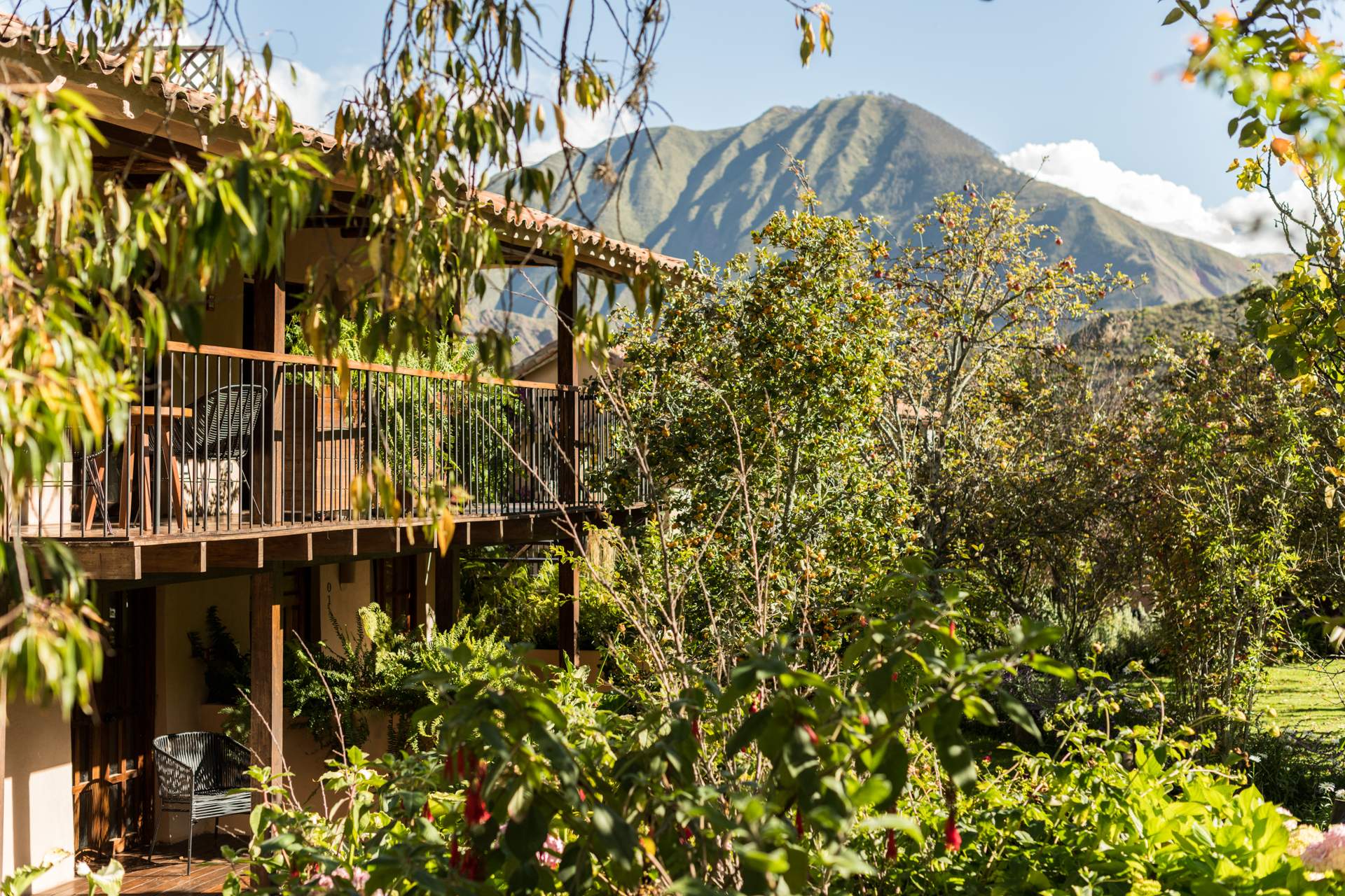 A house with a deck overlooking a mountain.