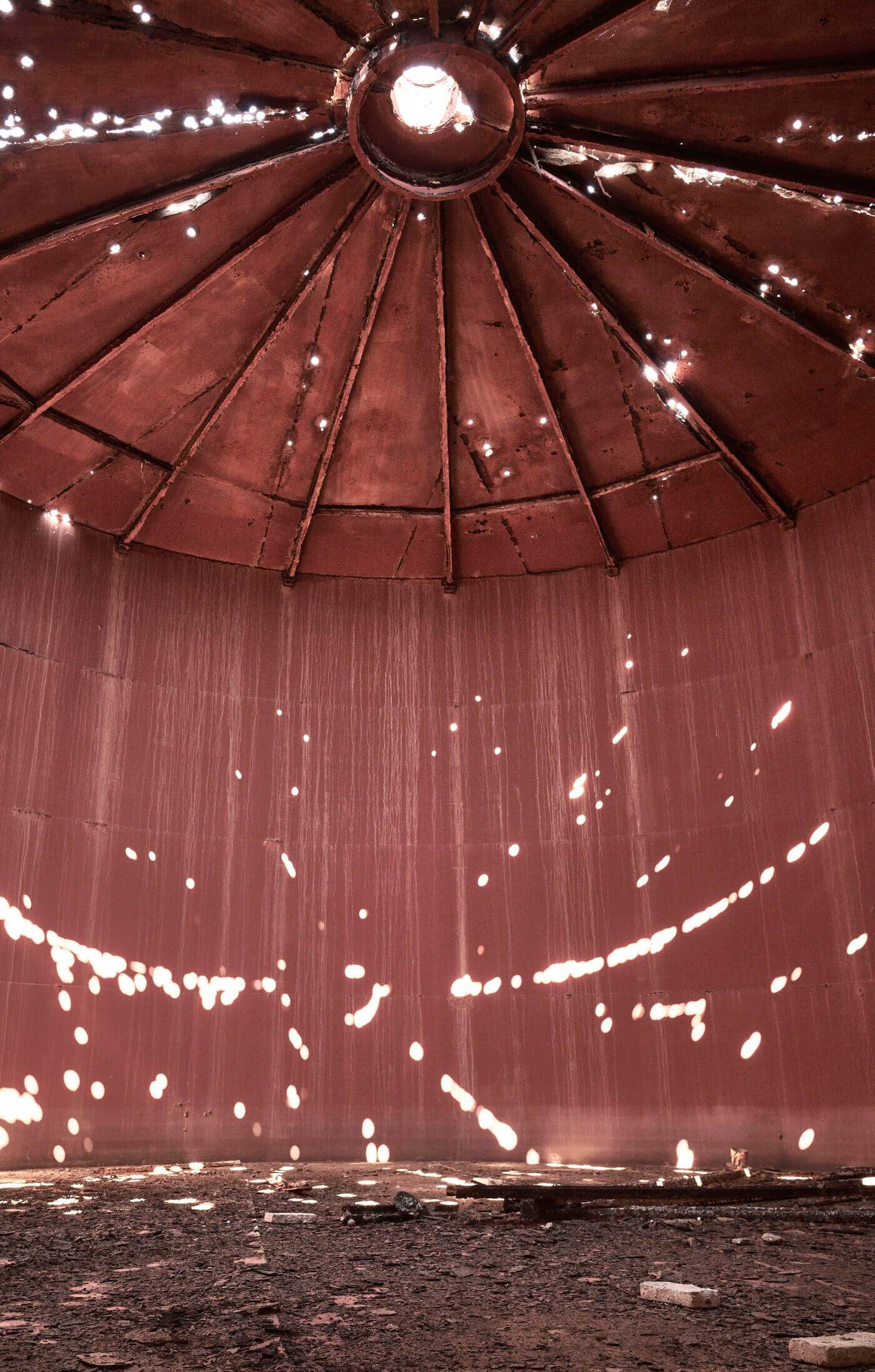 A large metal dome with a hole in the center.