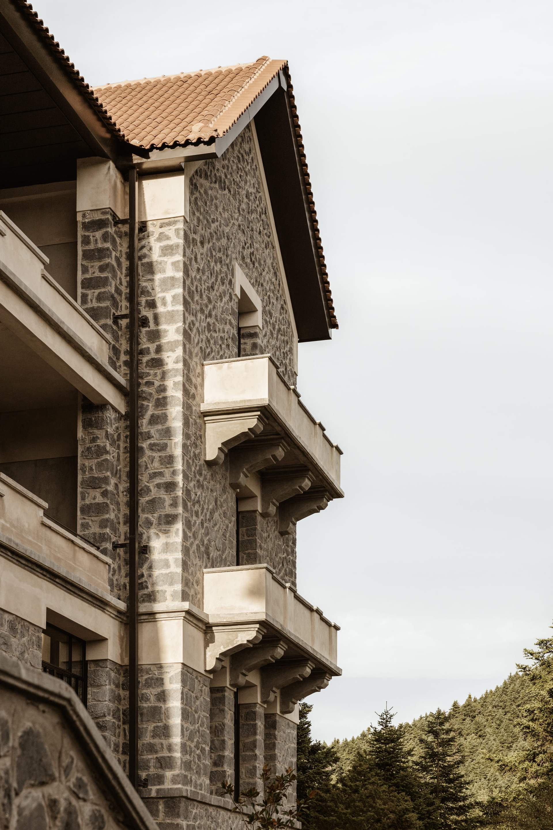 A building with a brick facade and a balcony.