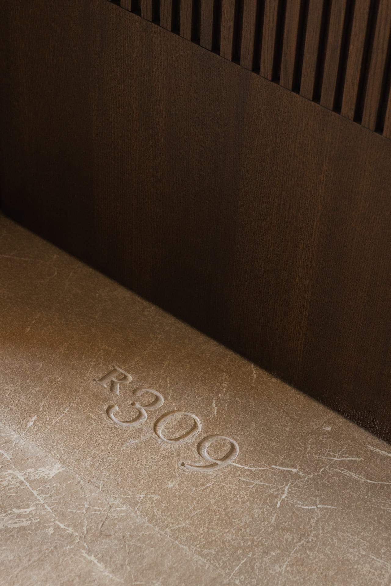 A stone with the number 3090 on it.