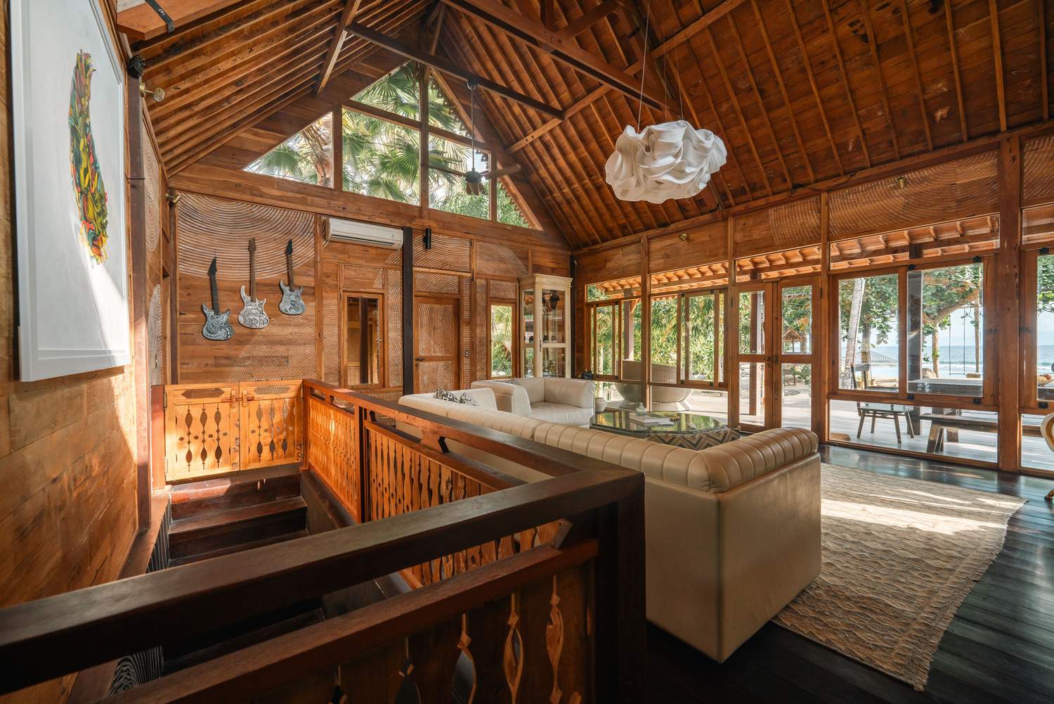 A living room with a guitar shaped railing.