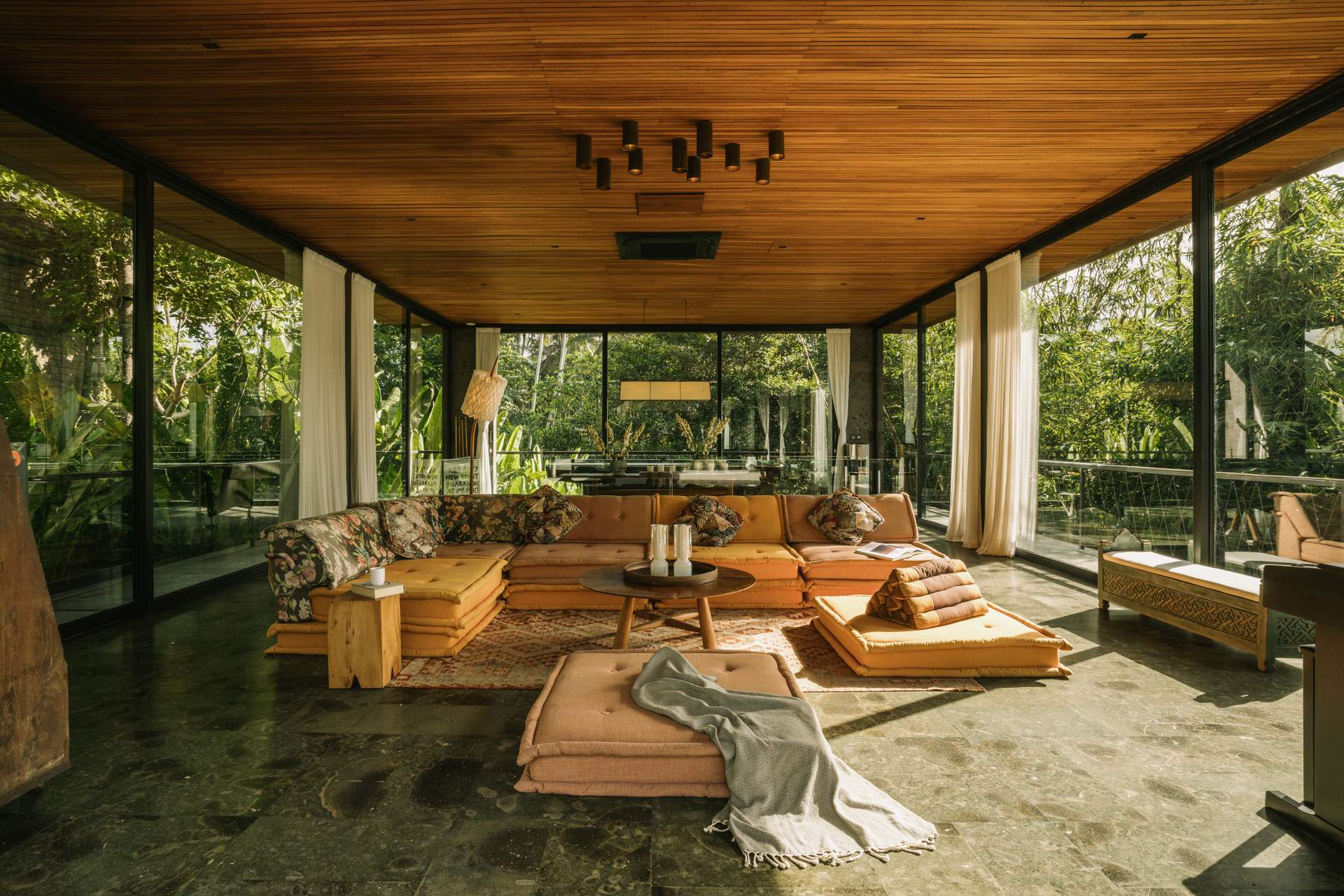 A living room with a couch and a chair.