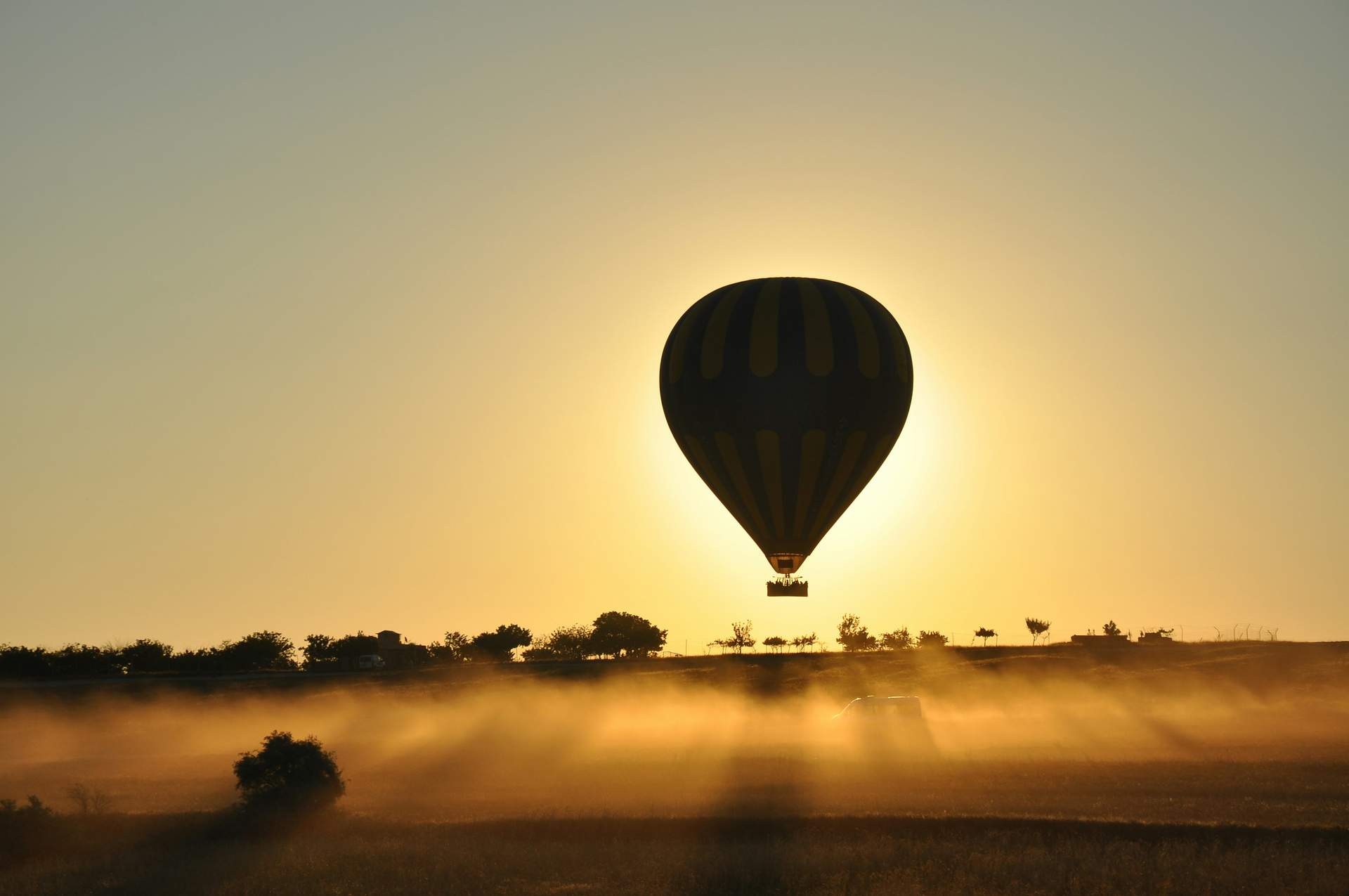 A hot air balloon is flying in the sky.