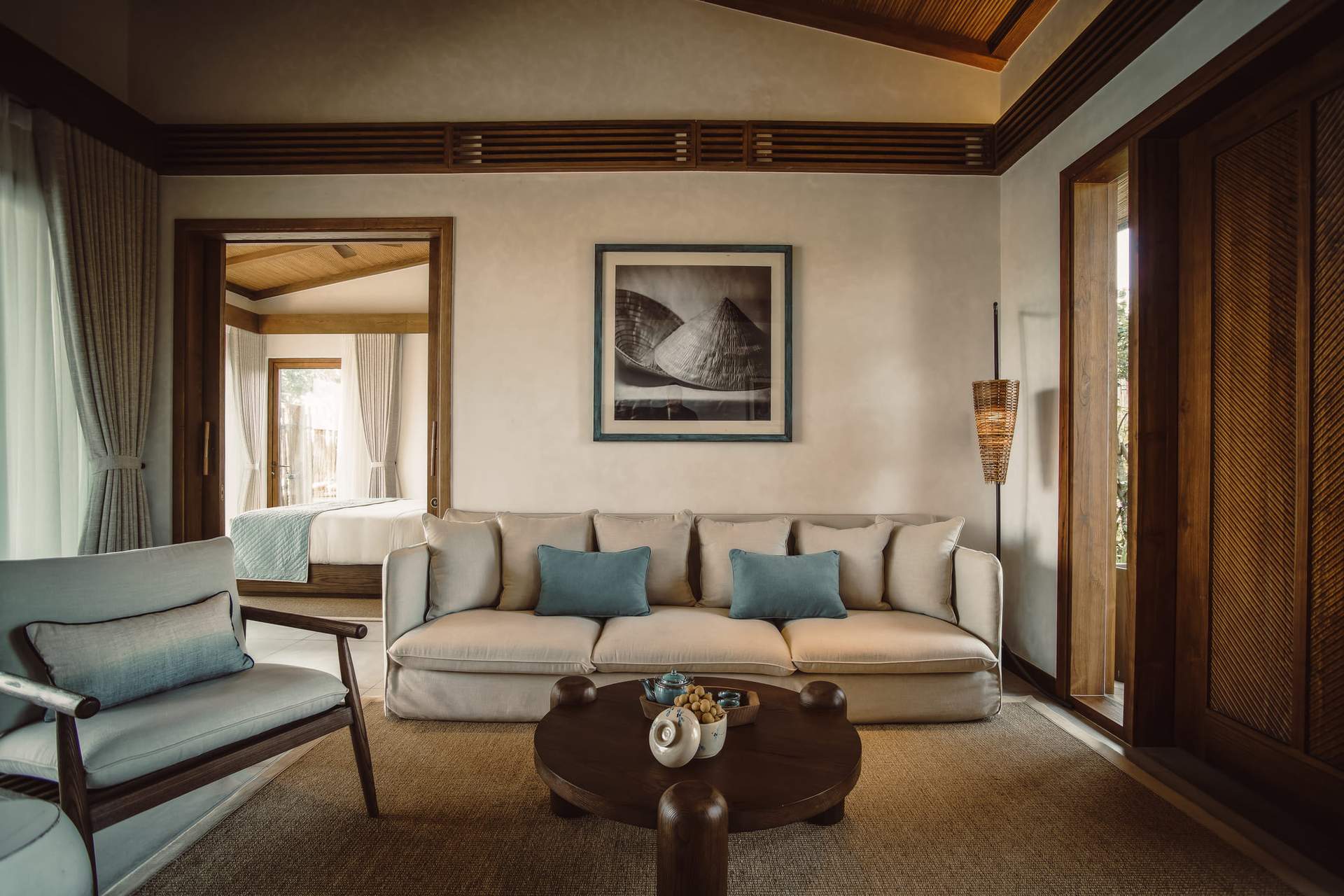 A living room with a couch, chair, and table.