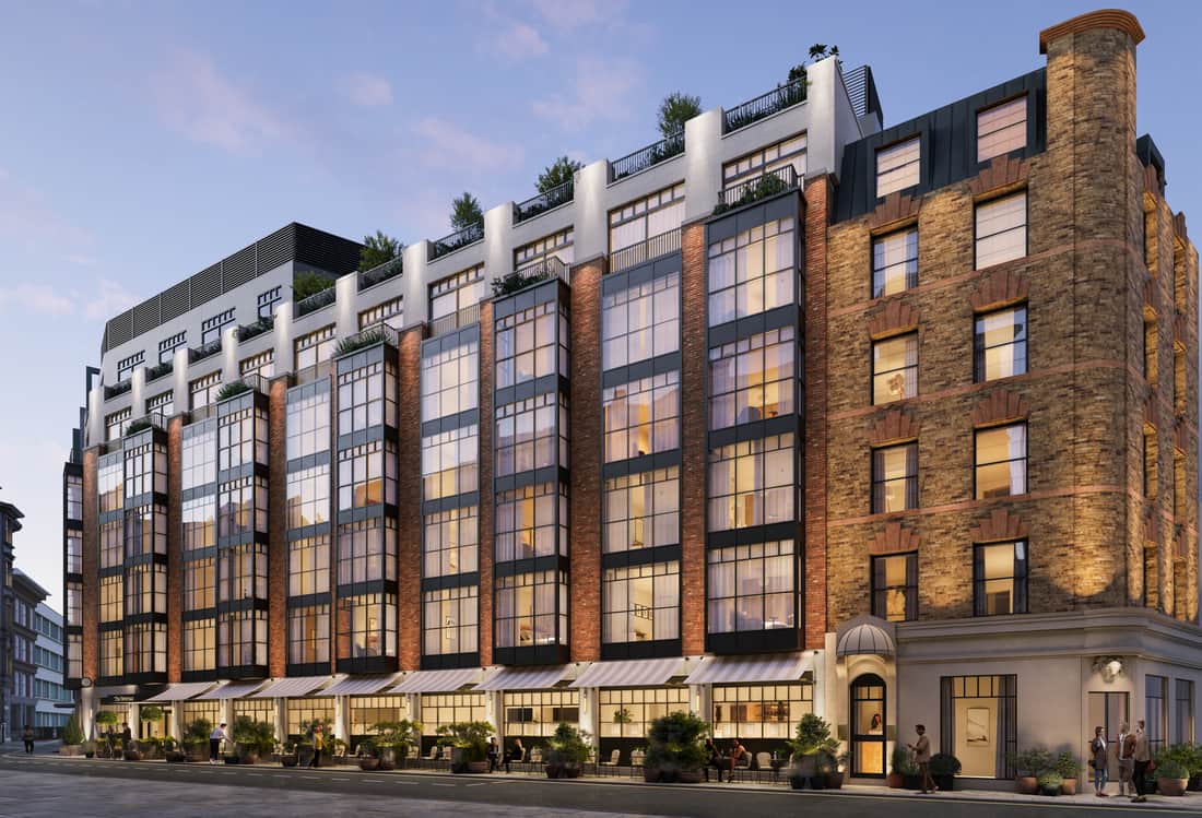 A large brick building with many windows and balconies.